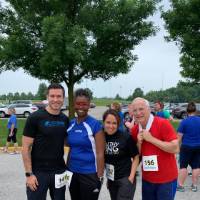 Adam MacRae, Tara Bivens, Elisa Salazar and Dave Smith standing together and smiling before the race
